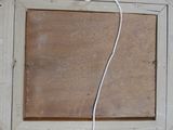 a white cord that is connected to a wooden frame