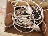 a box with a bunch of wires in it on the floor