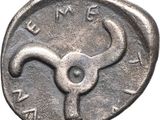 a close up of a coin with a bull head on it
