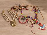 a lot of jewelry on a table on the floor