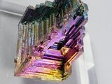 a very colorful piece of crystal that is on display