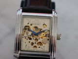 a close up of a watch with a black strap
