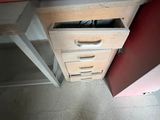 a wooden cabinet with a drawer underneath it in a room