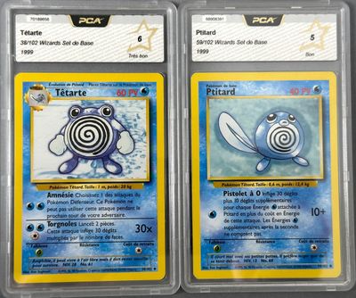 two pokemon trading cards are on display in a store