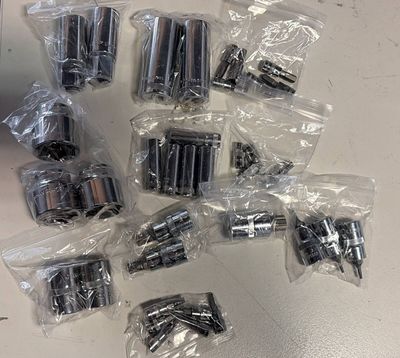 many different types of screws and nuts in bags
