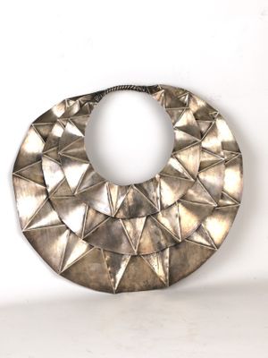 necklace made of silver metal triangles on a white background