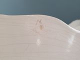 a white toilet with a dirty seat in a bathroom