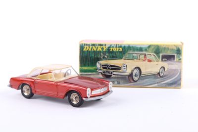 a toy car that is sitting next to a box