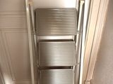 a ladder that is leaning against a wall in a room