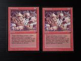 two cards that are sitting on a table
