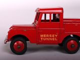 a red toy truck that is sitting on a table