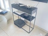 a picture of a living room with a flat screen tv on a stand