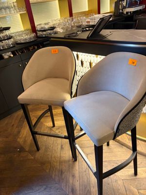 two chairs that are next to each other in a room