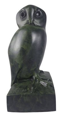 an image of a statue of an owl sitting on top of a base