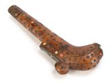 a wooden object that is shaped like a gun
