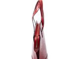 red leather handbag on white background with a zippered handle