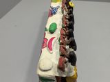 a cake that is shaped like a train with people on it
