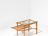 the table is made of wood and has a glass top