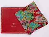 an image of a red box with a red and green paisley design on it
