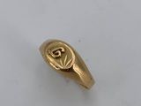 an image of a gold ring with an eye on it
