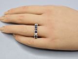 an image of a woman ' s hand with a ring on it