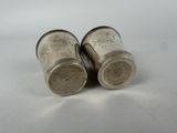 pair of silverplated salt and pepper shakers on white background