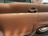a close up of a car door handle and the door handle of the car
