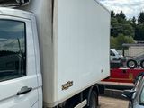a white truck that is parked in a lot