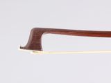 a close up of a bow on a white surface with a white background