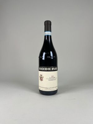 a bottle of red wine sitting on top of a table