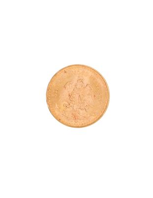 a gold coin on a white surface with a white background