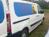 a van that is parked in front of a building