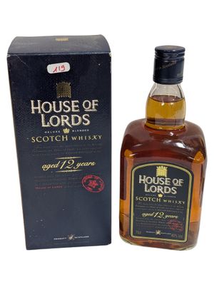 a bottle of house of lords scotch whisky next to a box