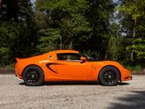 an orange sports car that is parked in the parking lot