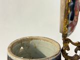 a coffee cup with a handle and a spoon in it