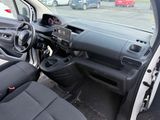 a car that is sitting in a parking lot with its door open