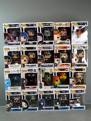 a lot of pop vinyl figures on display on the table