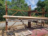 a wooden structure that is sitting on the side of the road