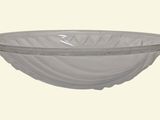 a white glass bowl with a decorative design on it