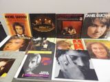 a lot of music books on a white table