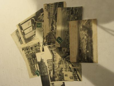 a pile of old postcards on a table