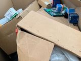 a cardboard box full of toilet paper and other items