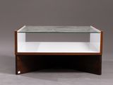 a close up of a table with a glass shelf on top of it