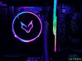 a close up of a computer case with a neon logo on it