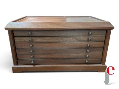an image of a wooden chest of drawers with a glass top