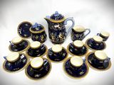 many cups and saucers that are sitting on a table
