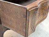 a wooden desk with a drawer underneath it