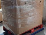 a pallet with a large box on it in a warehouse