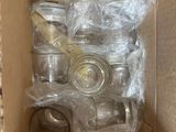 a box with a lot of empty glass bottles inside of it