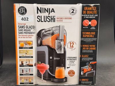 a box with a juicer inside of it on a table